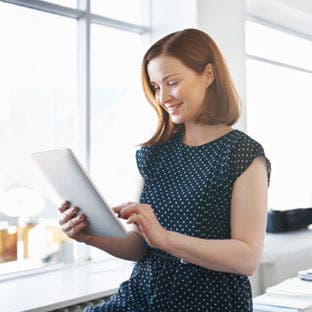 woman using tablet in office